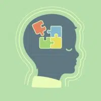 Illustration of a child's profile with puzzle pieces inside the head, symbolizing cognitive development or mental processing, highlighting autism awareness.