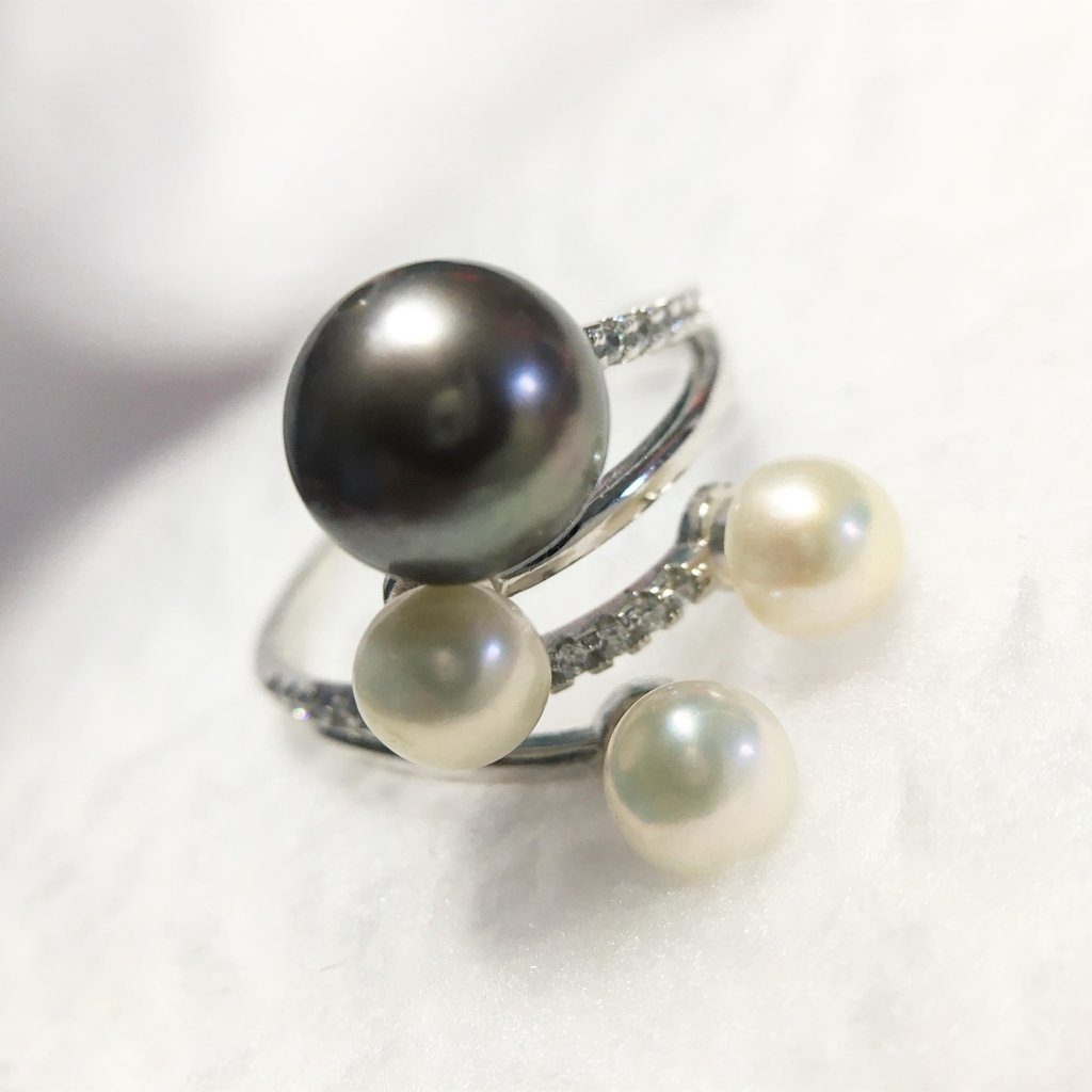 Whether you're getting ready for a night out or a day at the office, this piece will put a spring in your step. The natural color cultured freshwater pearls combine with the rare grace of the dark pearl bring a quiet confidence that's hard to ignore. 
