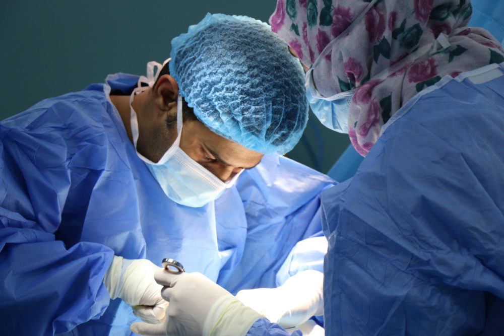 doctor performing cosmetic surgery