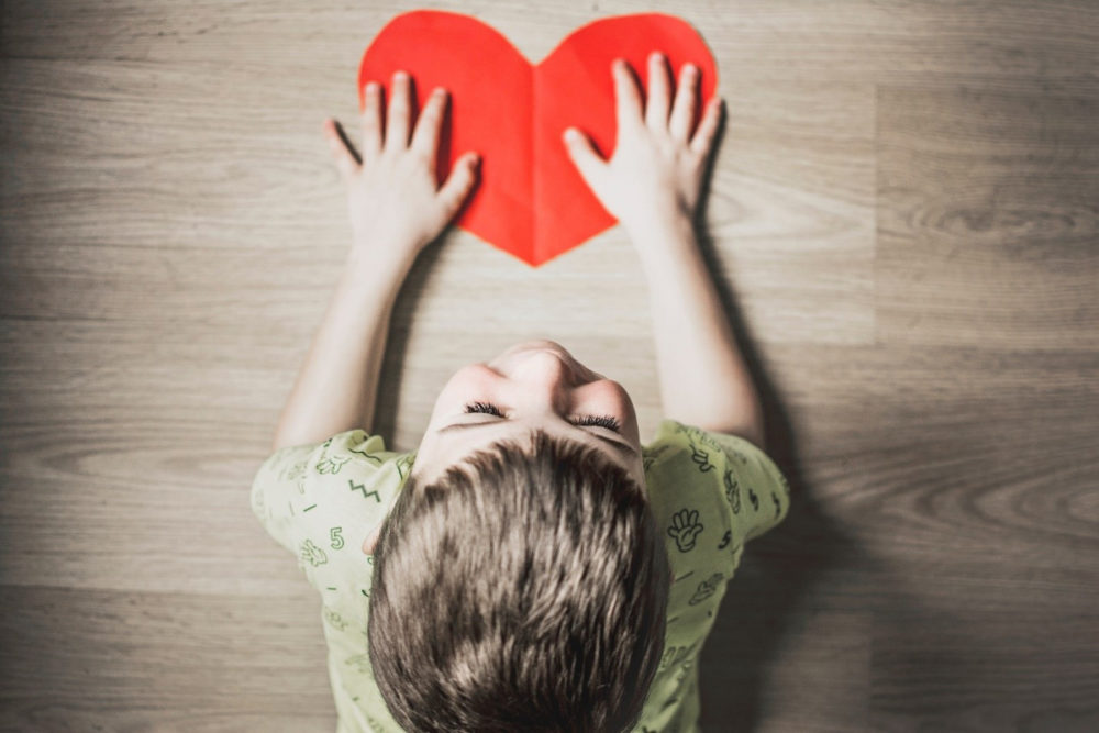 child holding a heart
