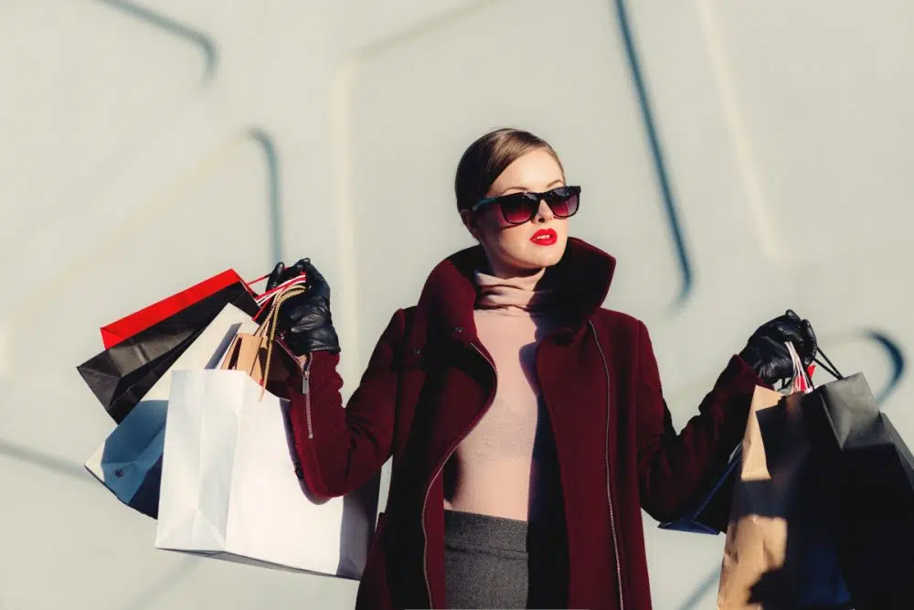 person holding shopping bags