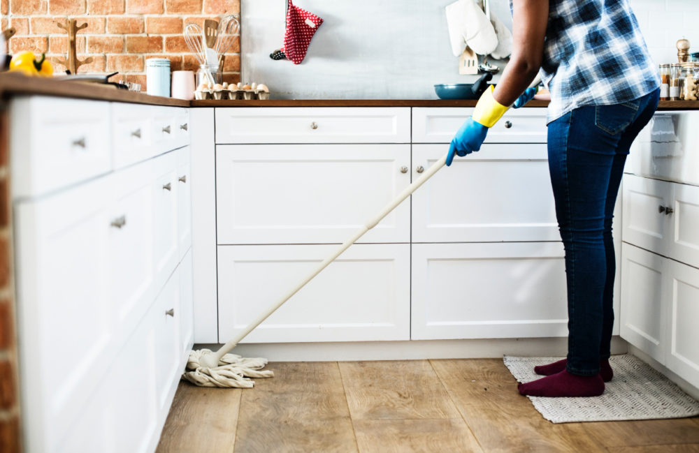 person mopping floor