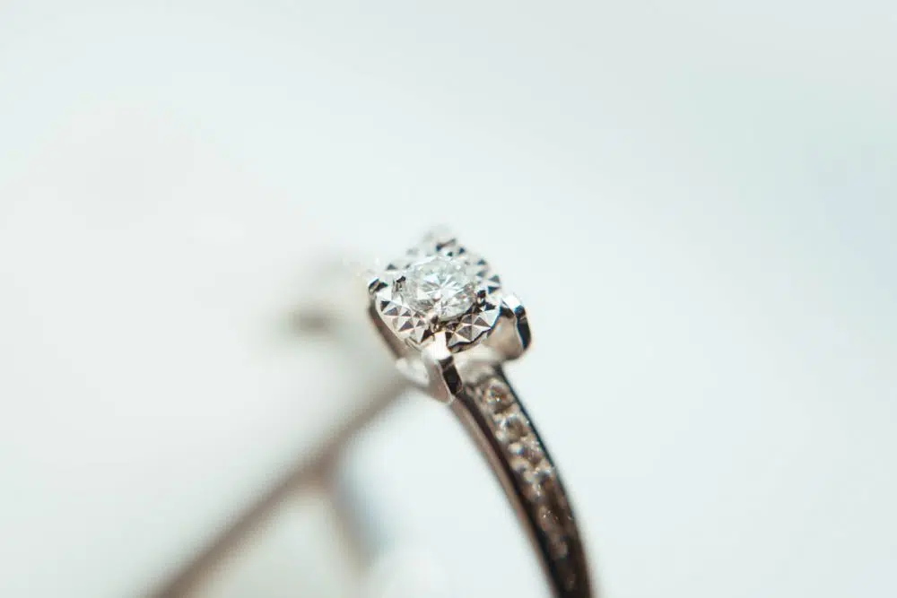 silver-colored clear gemstone ring