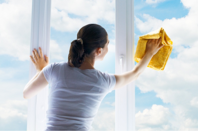 woman cleaning window