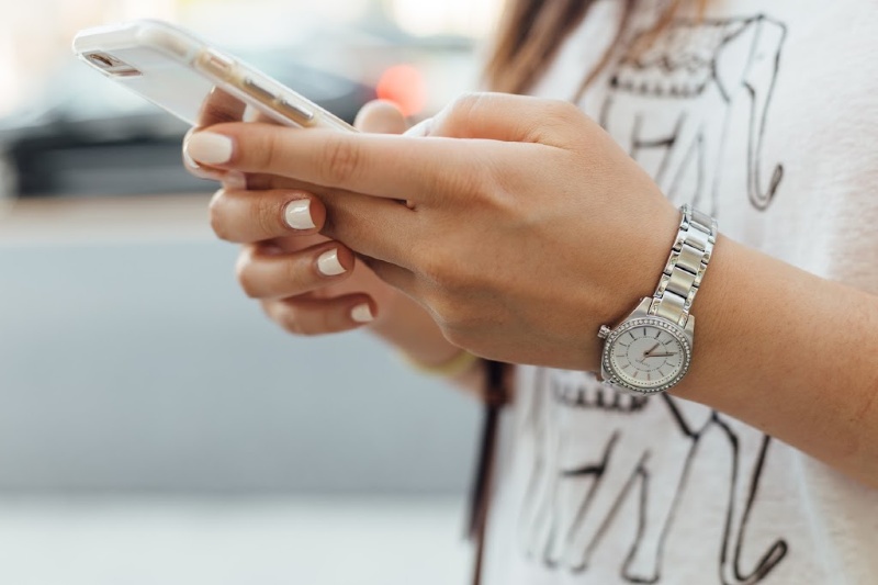 lady holding cell phone