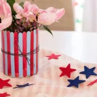 Patriotic Popsicle Stick Vase on table with stars around it