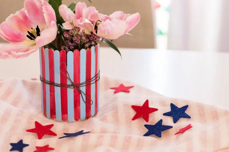 Patriotic Popsicle Stick Vase on table with stars around it