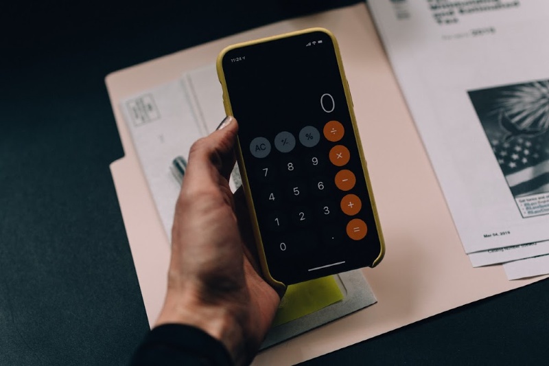 person holding a calculator 