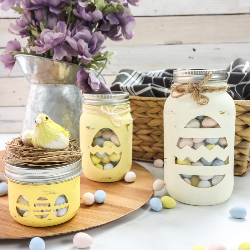 Cricut Chalky Painted Easter Candy Jars sitting on a white table 