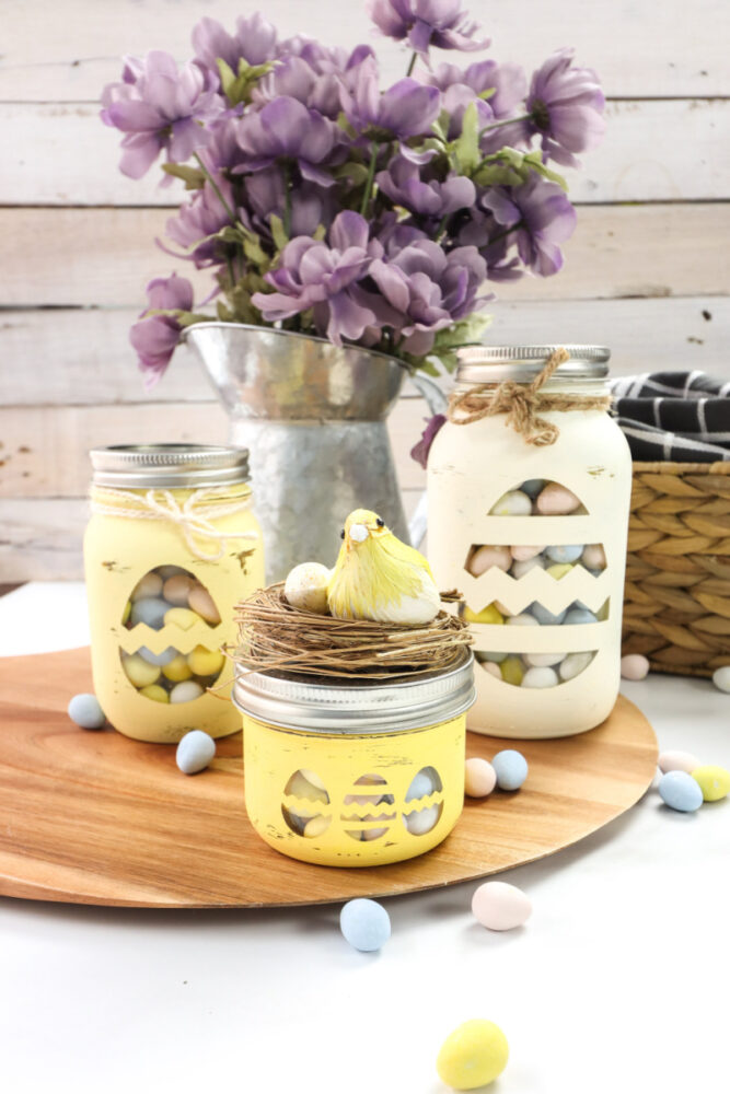 Cricut Chalky Painted Easter Candy Jars on a table