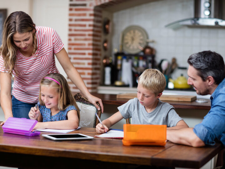 Parents helping the kids with their homework