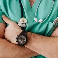 Crop unrecognizable male doctor with stethoscope