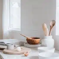 White Ceramic Plates and Bowls on White Kitchen Countertop