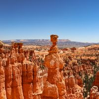 Dramatic view of hoodoos at Bryce Canyon National Park under clear blue skies.